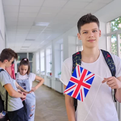teenager-student-with-british-flag-school-corrido-2023-11-27-05-03-23-utc